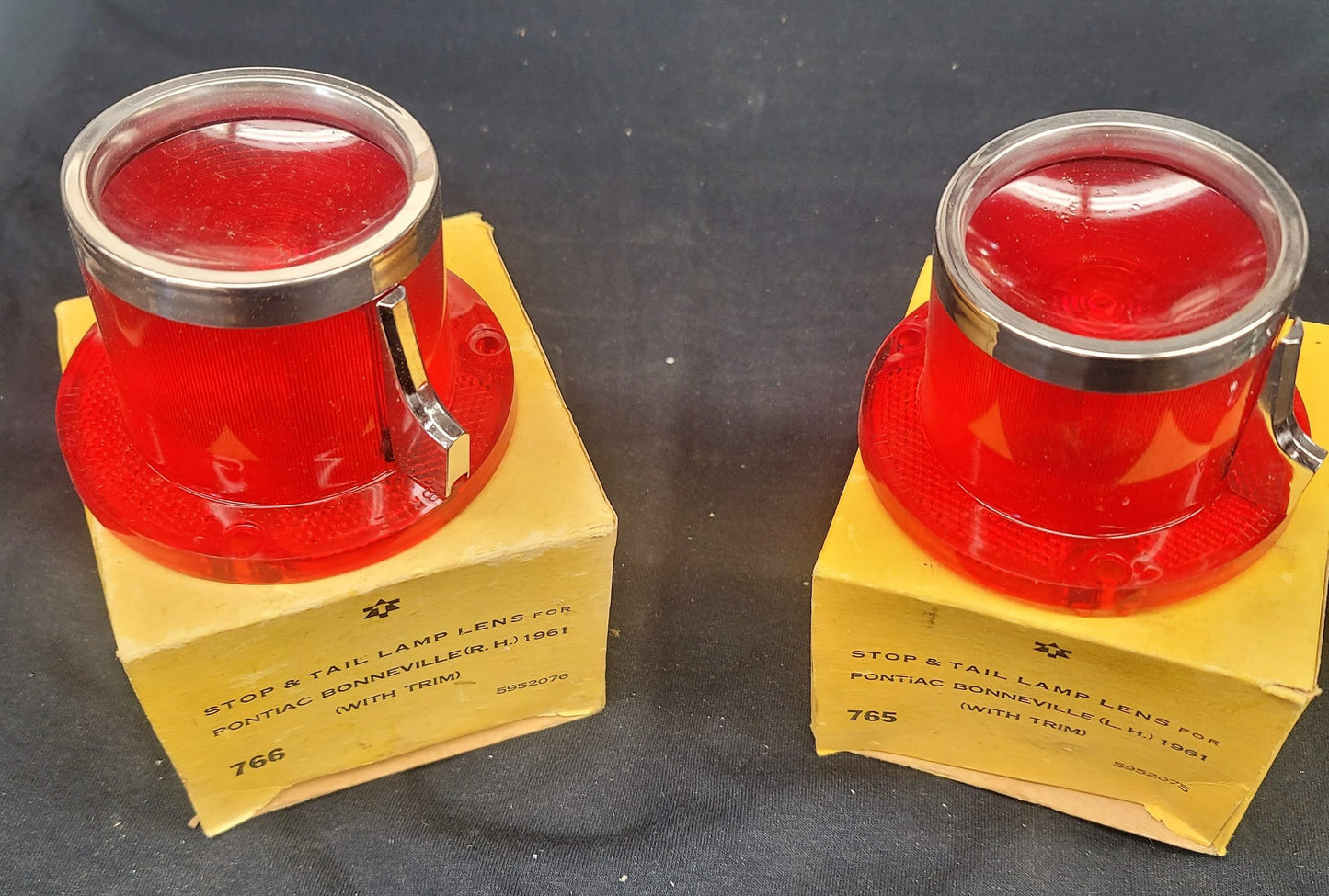 1961 PONTIAC BONNEVILLE STOP AND TAIL LAMP LENSES WITH TRIM IN ORIGINAL BOX NOS